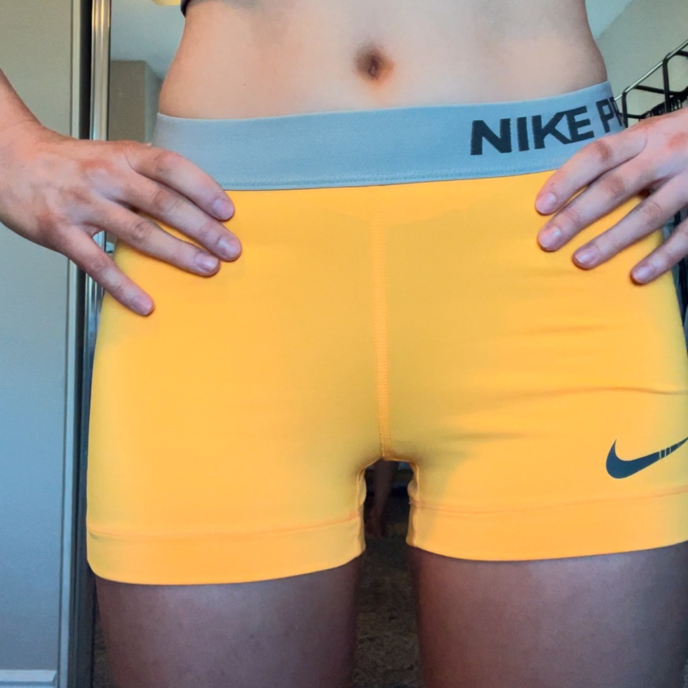 Orange NIKE Pros